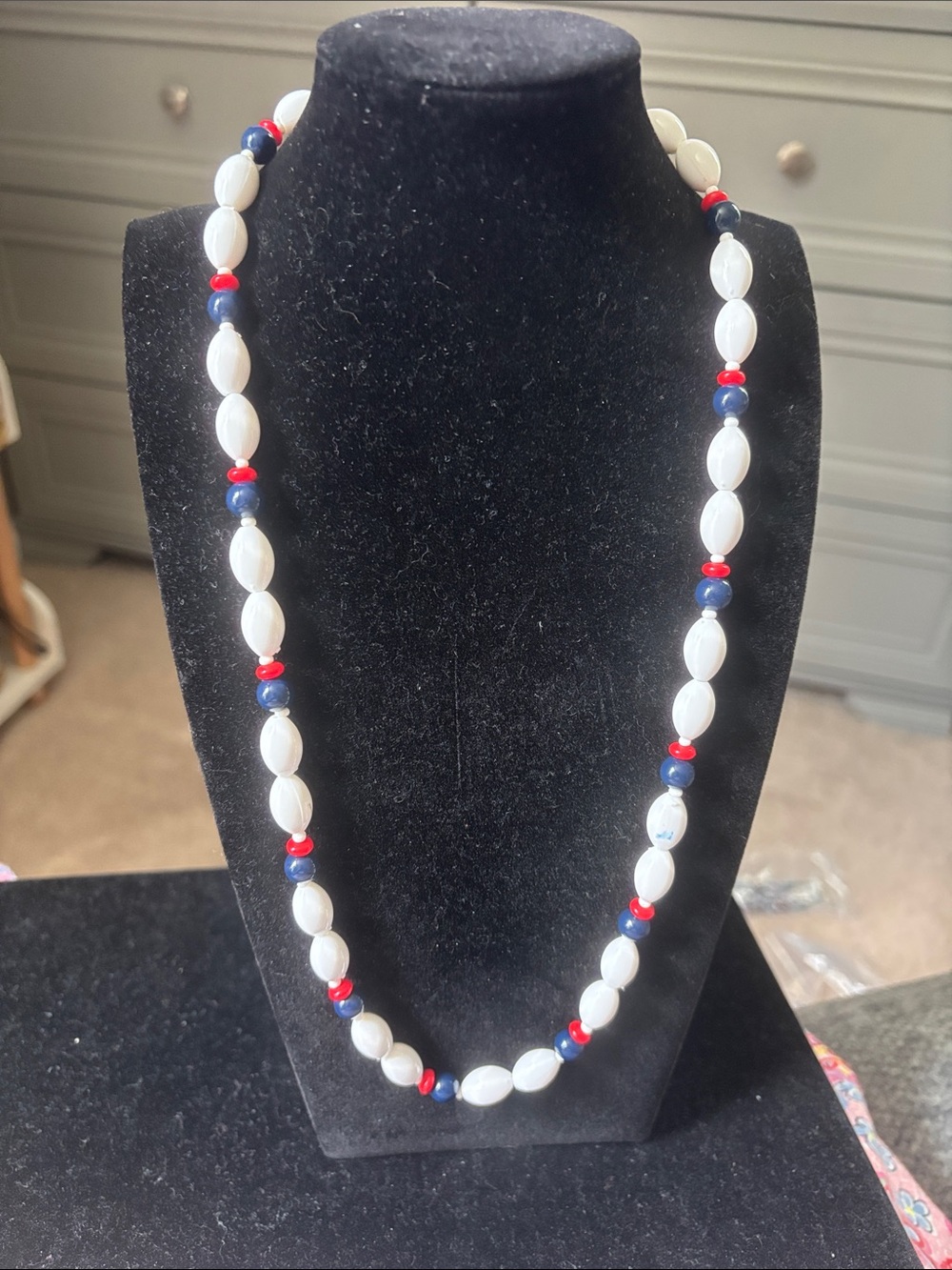 White Beaded Necklace with Red and Blue Accents